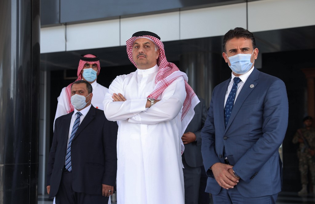 Qatari Defense Minister Khalid bin Muhammad al-Attiah (C) waits for the arrival of his Turkish counterpart to meet with Prime Minister of Libya's UN-recognised Government of National Accord (GNA) Fayez al-Sarraj (unseen) in the capital Tripoli, on August 17, 2020. 