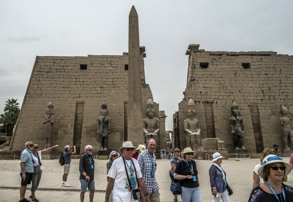 Tourists visit the Luxor Temple in Egypt's southern city of Luxor, on March 11, 2020. Egyptian authorities said that 46 French and US tourists
