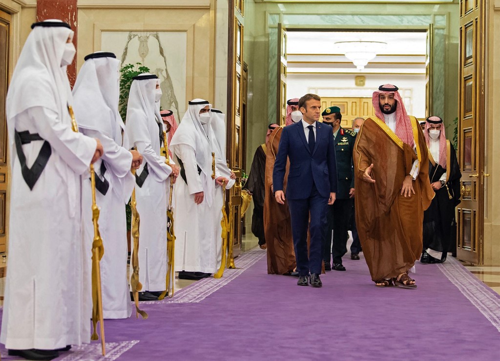 Saudi Crown Prince Mohammed bin Salman receives French President Emmanuel Macron in Jeddah on 4 December 2021 (Bandar al-Jaloud/Saudi Royal Palace/AFP)