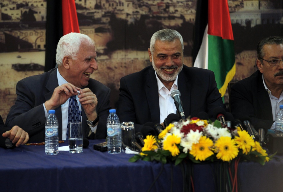 Hamas' Ismail Haniya with Palestinian Fatah delegation chief Azzam al-Ahmed  (AFP)