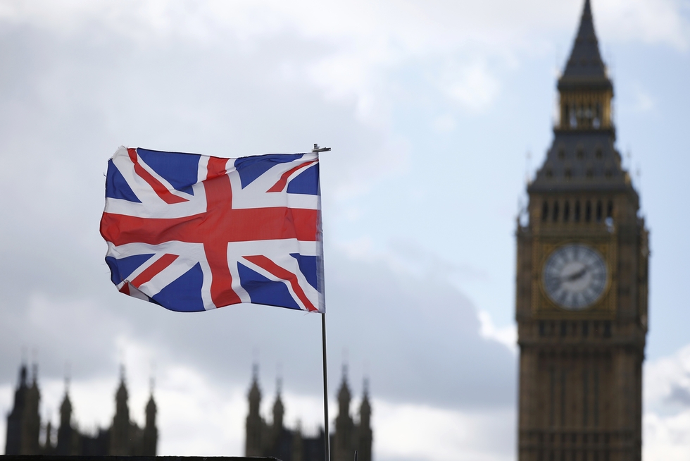 A souvenir flag flies in the breeze opposite the Houses of Parliament in London (Reuters)