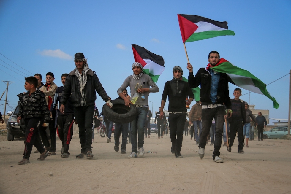 Palestinians demonstrate near the Gaza fence (MEE/Mohammed al-Hajjar)