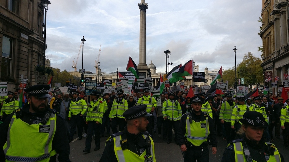 Pro-Palestine demonstrators march down a street in central London in 2017 (MEE/Areeb Ullah)