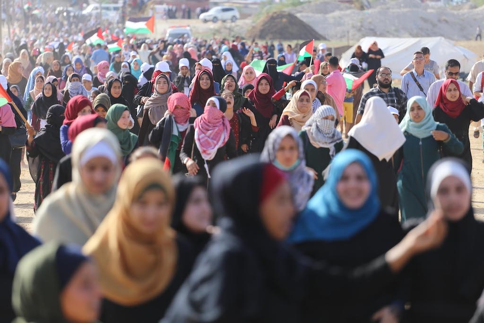 Hundreds of Palestinian women march in Gaza in 2018 (MEE/Mohammed Asad)