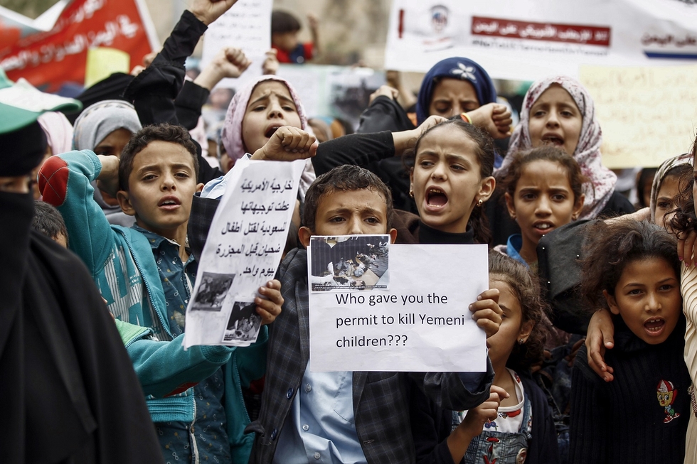 Children in Sanaa protest against deadly Saudi air strikes on Yemeni civilians on 12 August,2018 (AFP)
