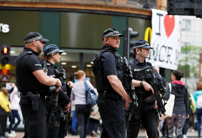 Armed police officers stand on duty in central Manchester, Britain in May, 2017 (Reuters)