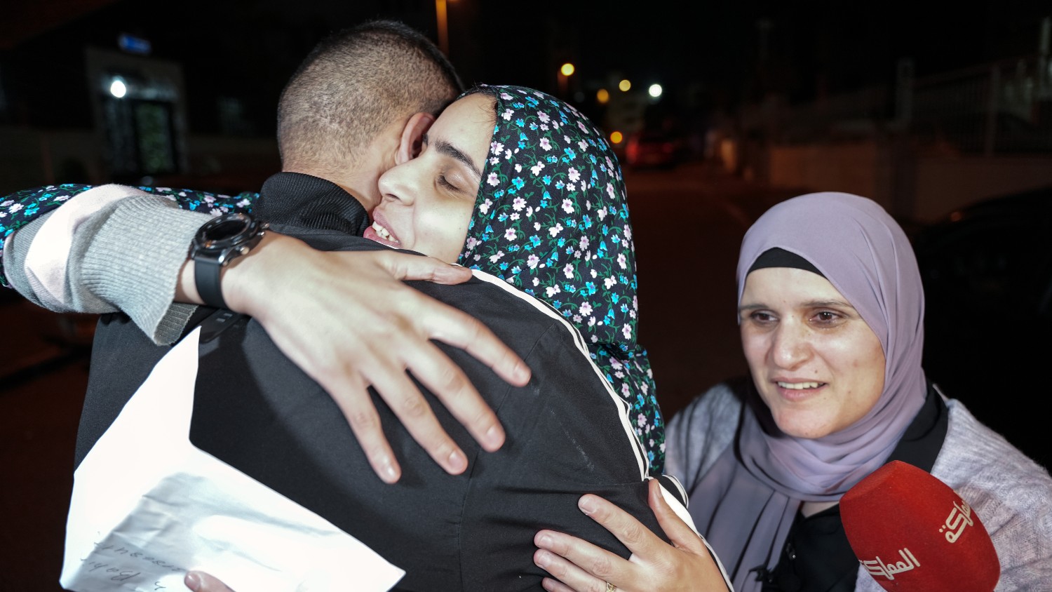 Marah Bikeer, one of the Palestinian prisoners released from Israeli detention on Friday, embraces her relatives.