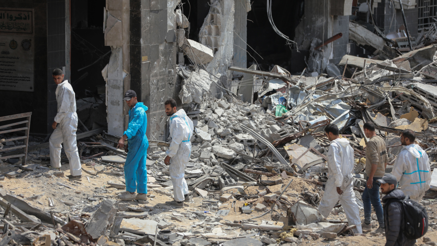 Teams from Gaza's ministries of health, interior and justice continuing their search and recover operations in al-Shifa hospital on 8 April 2024 (Mohammed al-Hajjar/MEE)