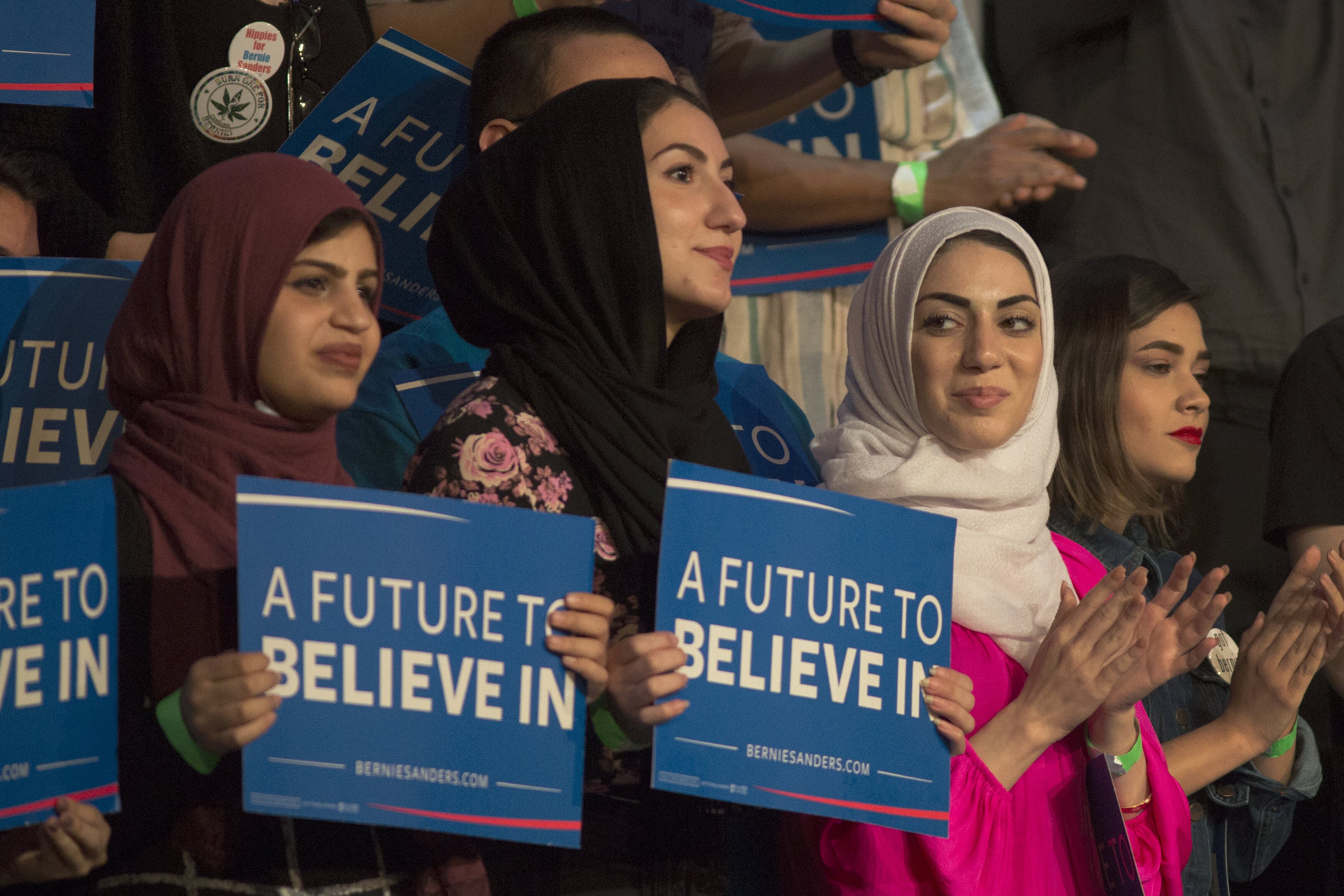 Muslim woman support Democratic presidential candidate Bernie Sanders at a campaign rally in California