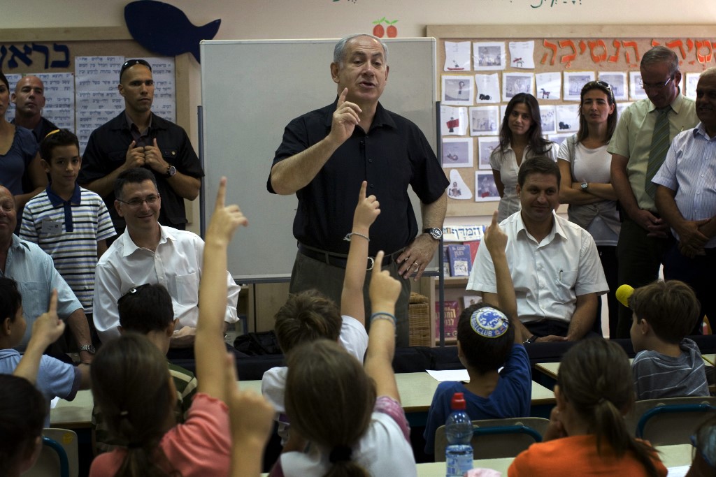 Israeli Prime Minister Benjamin Netanyahu visits a classroom in Modiin in 2009 (AFP)