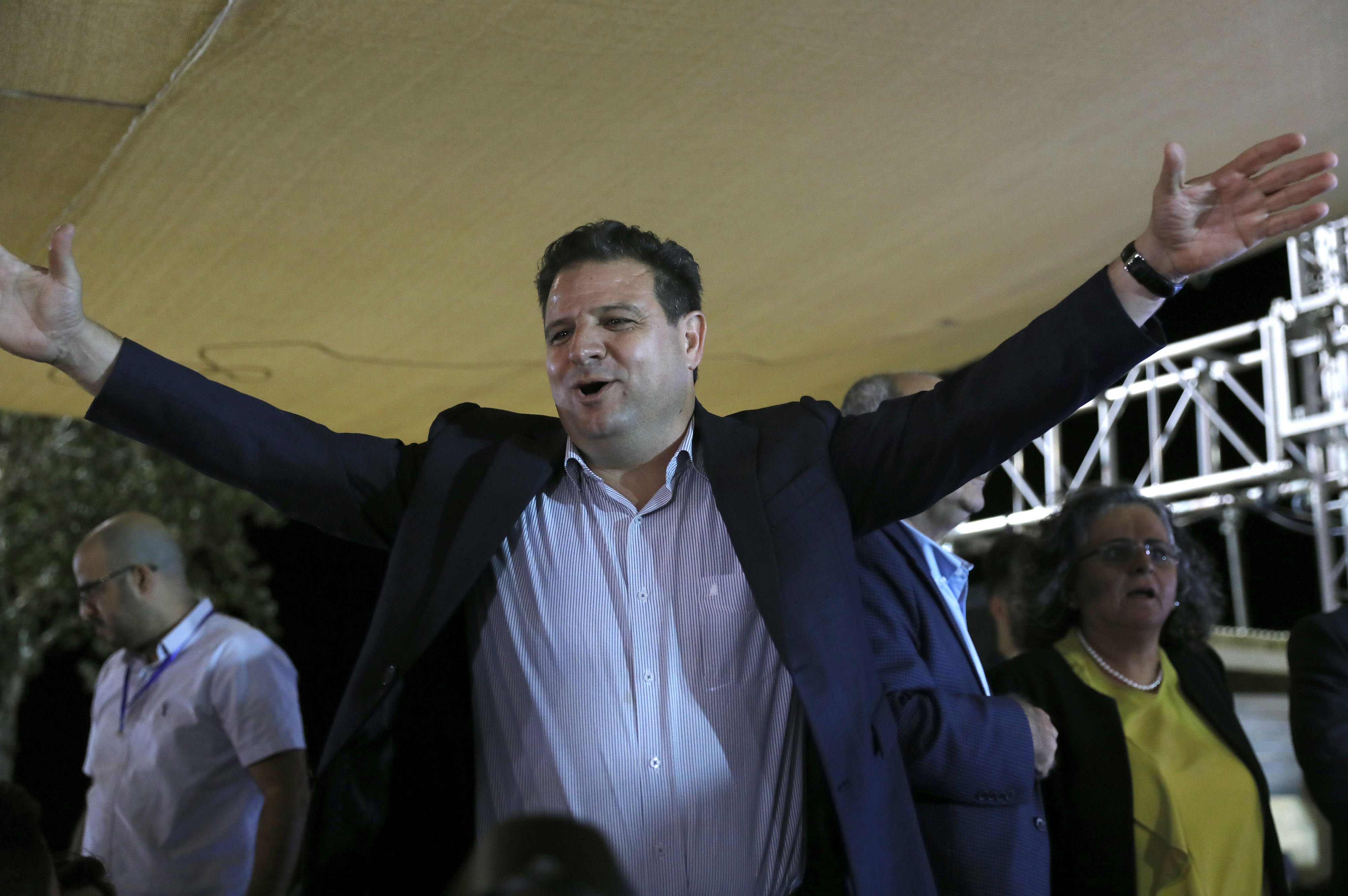Ayman Odeh celebrates in Nazareth as the exit polls come in (AFP)