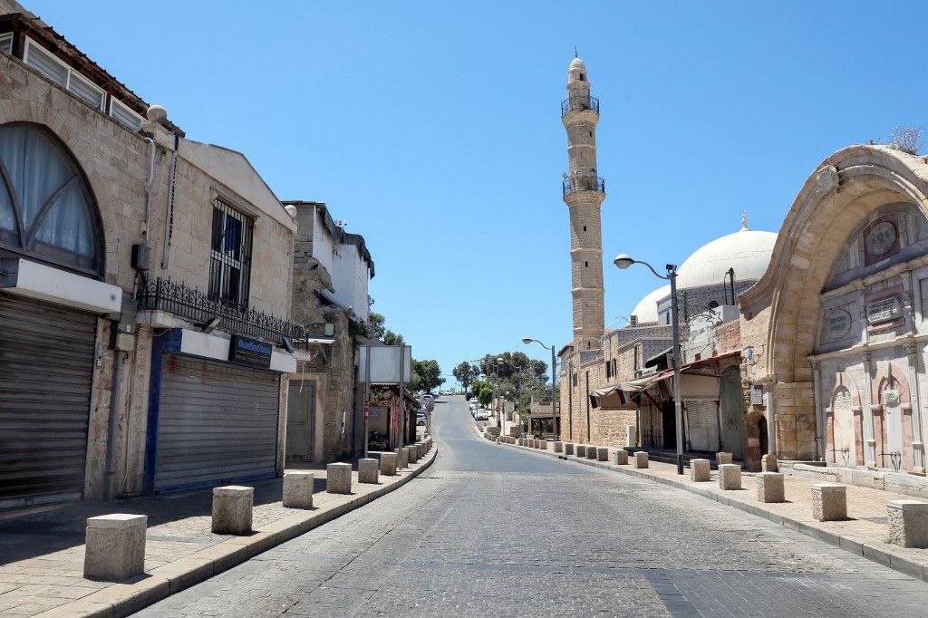 A general view shows shuttered stores in the Arab quarter of Jaffa, near the Israeli coastal city of Tel Aviv, during a general strike which was observed on May 18, 2021