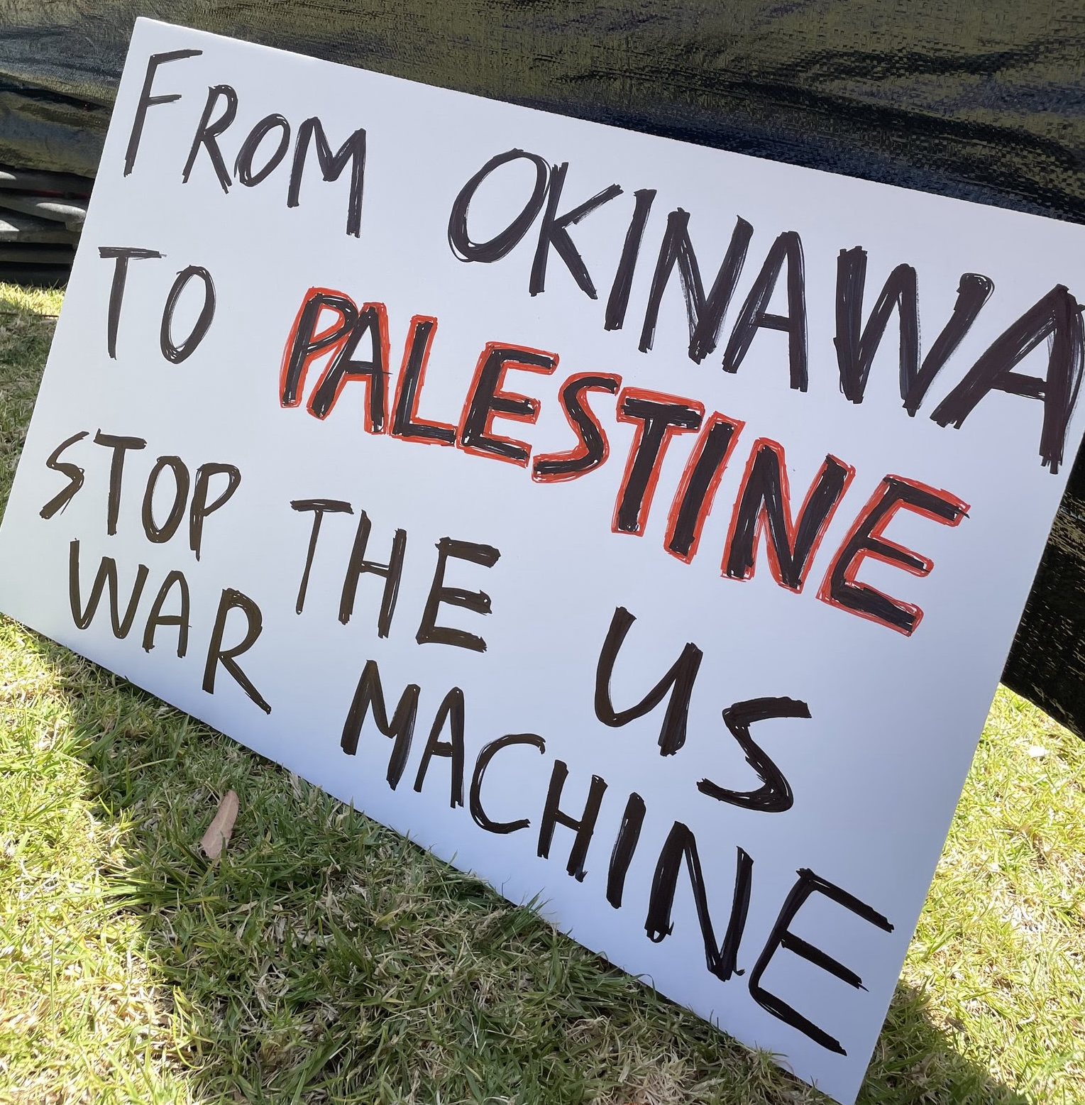 A poster connecting two occupied lands is displayed at a pro-Palestine student encampment at the University of California, San Diego on 1 May 2024 (Wendy Matsumura)