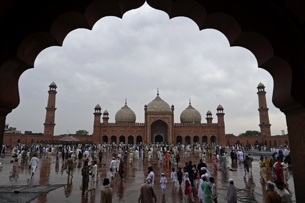 Muslims attend the Badshahi Mosque in Lahore, Pakistan, on 13 May 2021 (AFP)