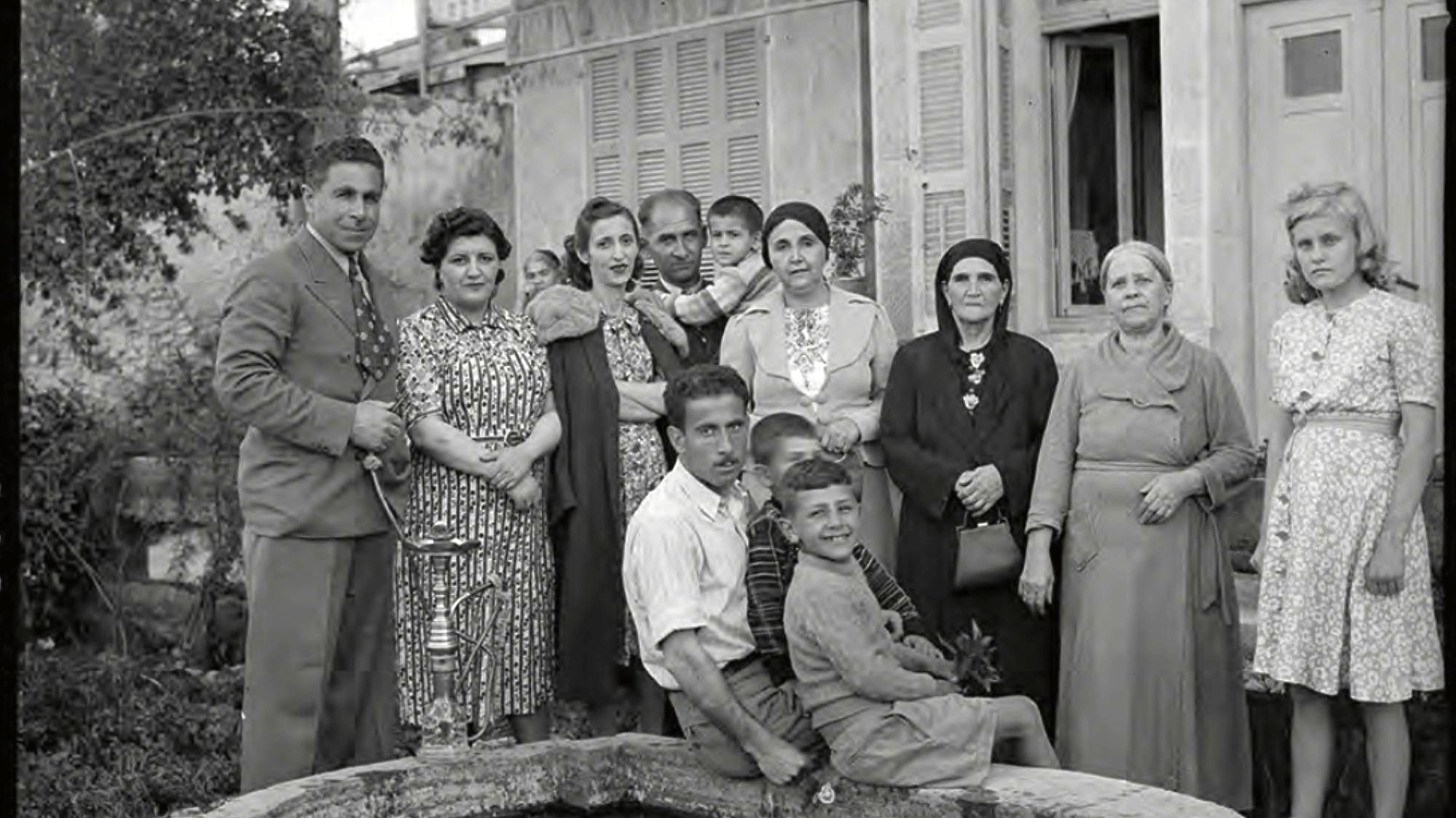 Acre State Stallion Farm staff in the garden of Jamil Pasha’s house in Haifa, April 23, 1940 (MEE/Haymarket Books) 