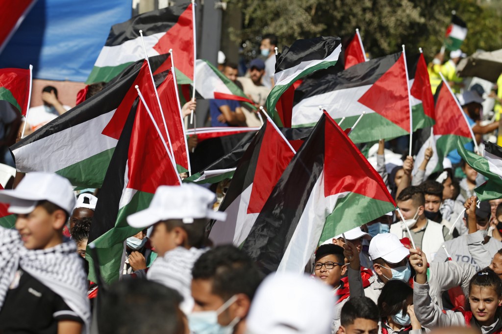 Palestinians protest the Israel-UAE deal in the village of Turmus Ayya on 19 August (AFP)