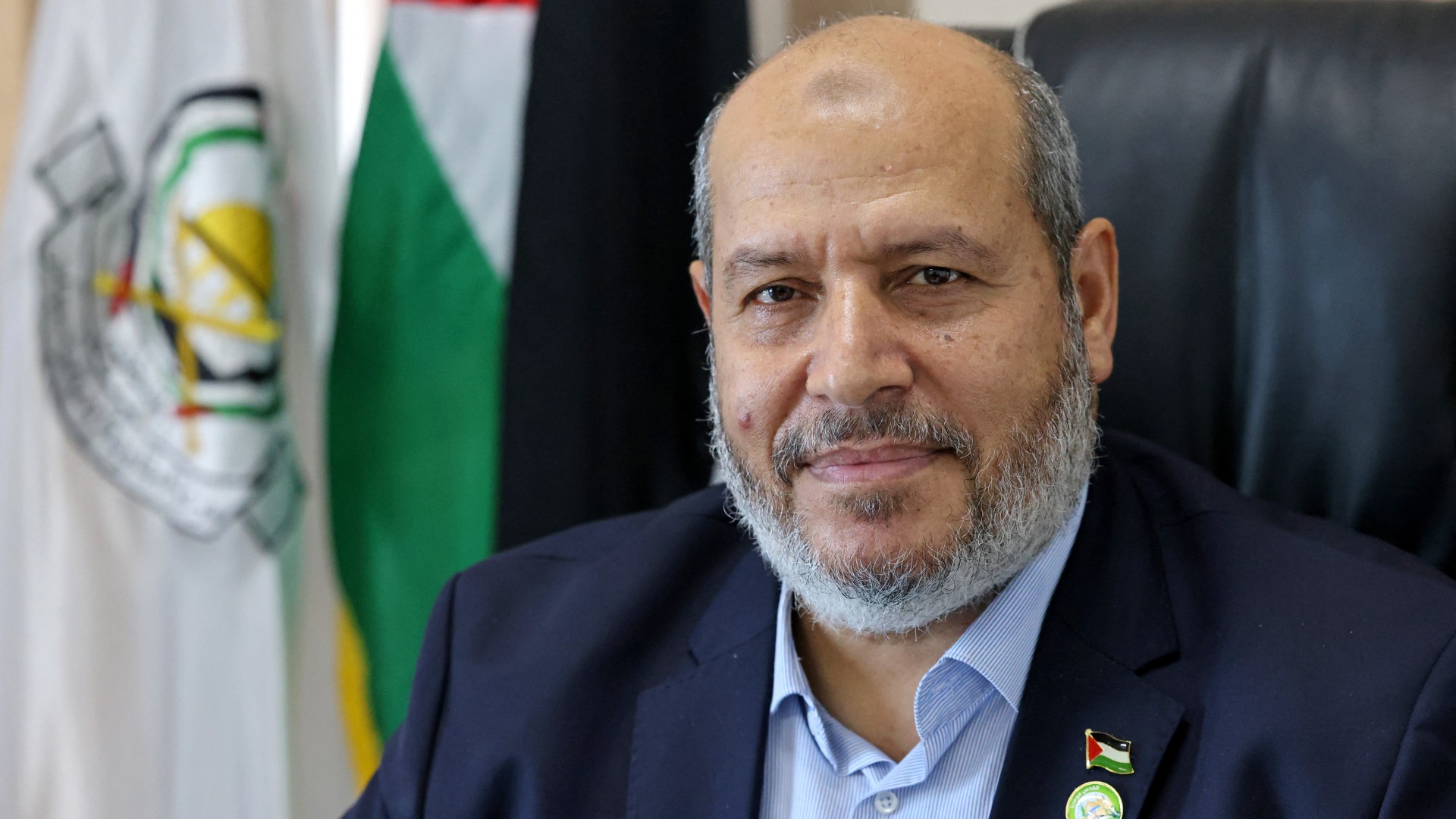 Senior Hamas leader Khalil al-Hayya smiles during an interview with AFP at his office in Gaza City on 21 April, 2021 (Emmanuel Dunand/AFP)