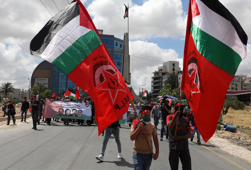 Palestinians protest against Israel’s annexation plan near Ramallah on 19 June (AFP)