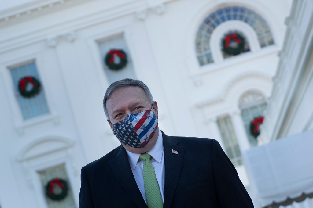 US Secretary of State Mike Pompeo leaves the White House on 11 December (AFP)
