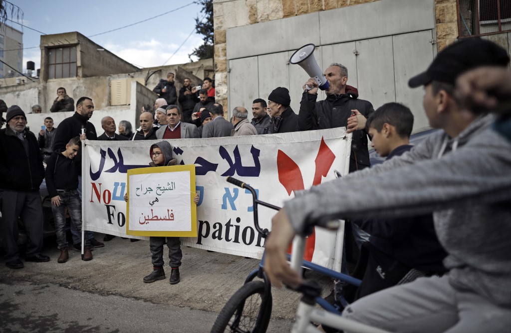  shout slogans during a protest near the house of a Palestinian family, which an Israeli court had ordered to be evicted while declaring Israeli settlers to be the legal owners, in 