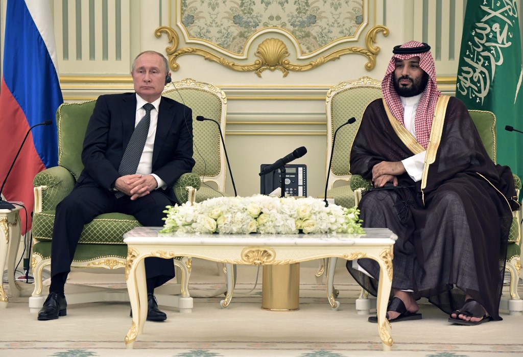 Russian President Vladimir Putin meets Saudi Crown Prince Mohammed bin Salman in Riyadh on 14 October (AFP)