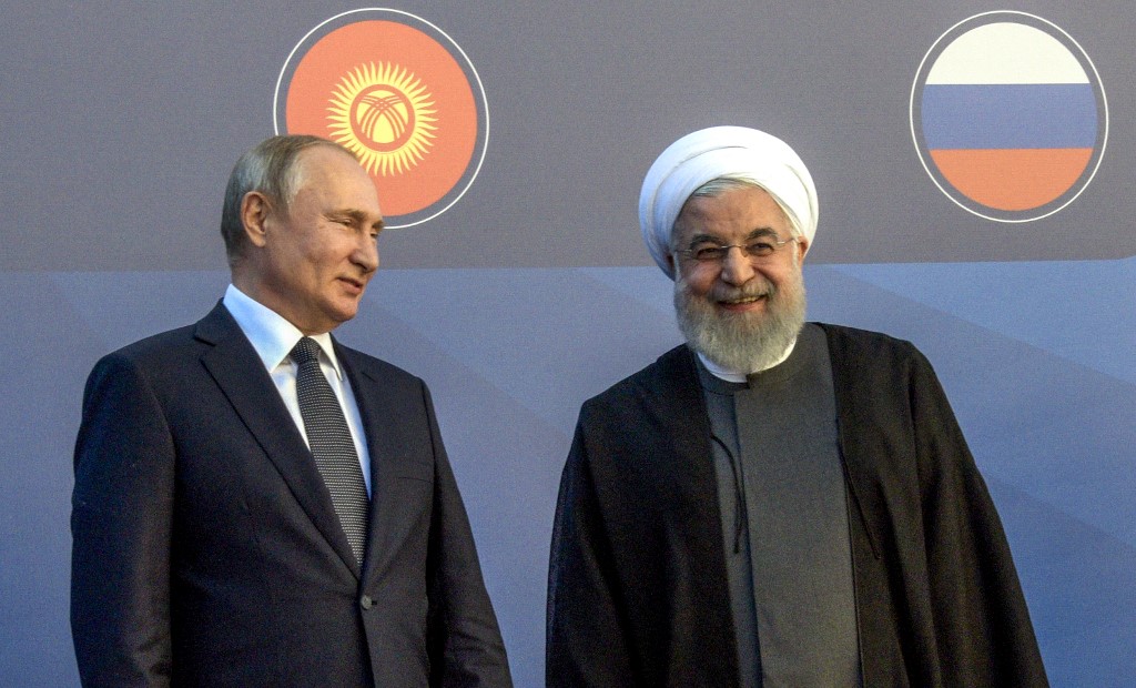 Russian President Vladimir Putin speaks with Iranian President Hassan Rouhani in Yerevan on 1 October (AFP)