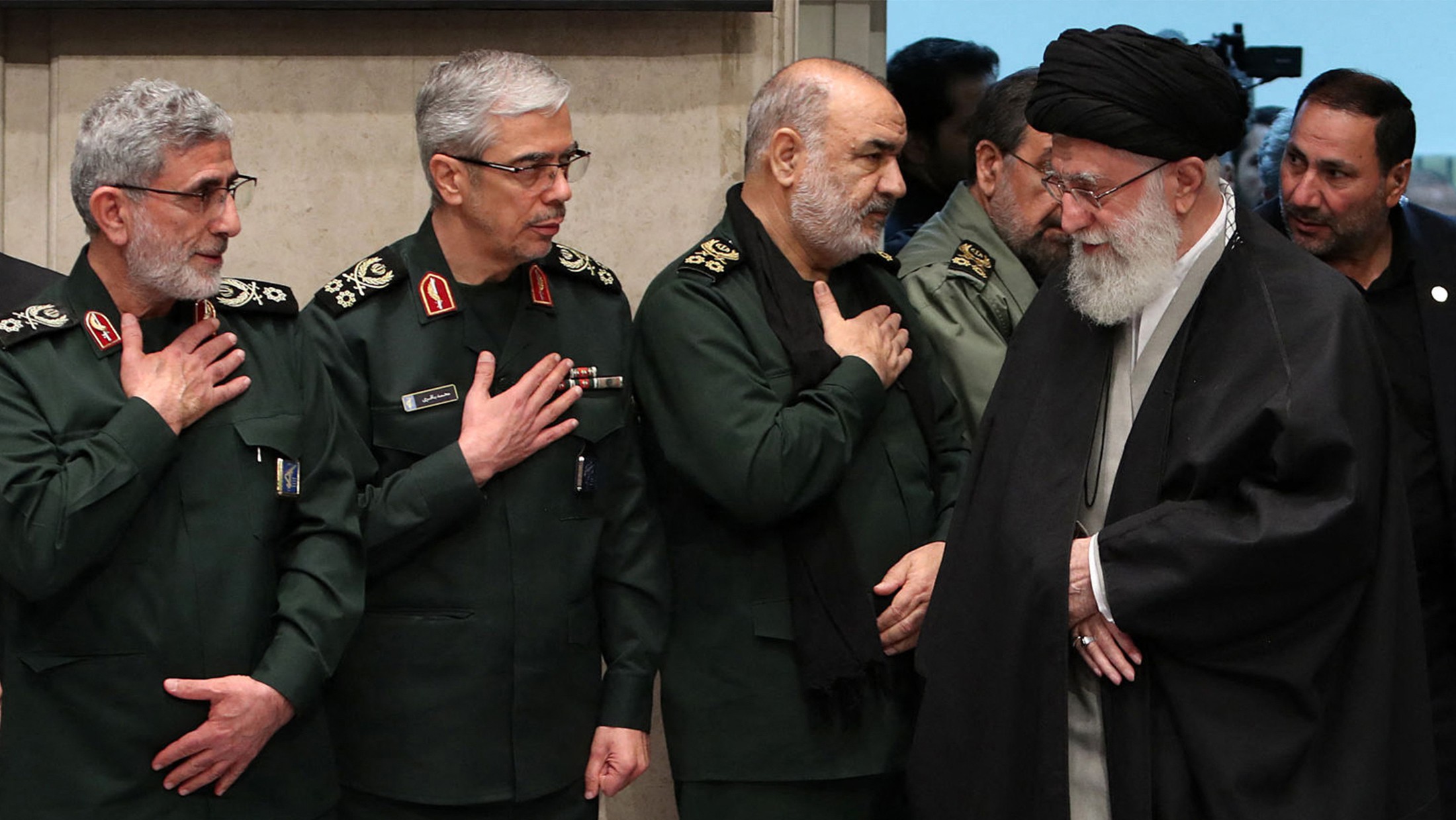 Ayatollah Ali Khamenei greeting newly appointed commander of the Quds Force Esmai Qaani, left, on 9 January, 2020 (AFP)