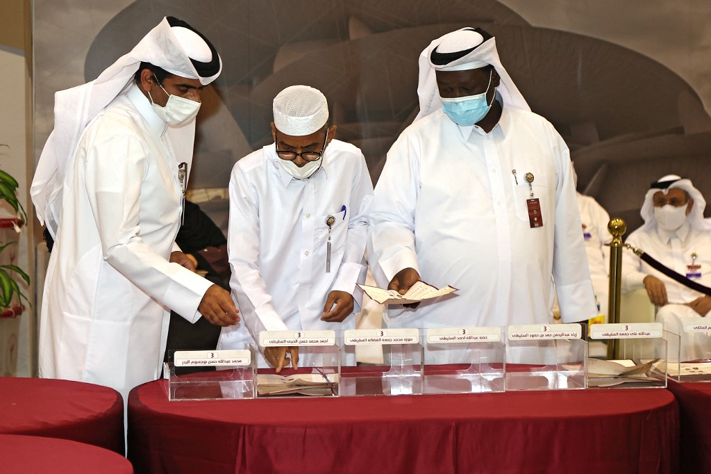 Qatari election officials count ballots in Doha on 2 October 2021 (AFP)
