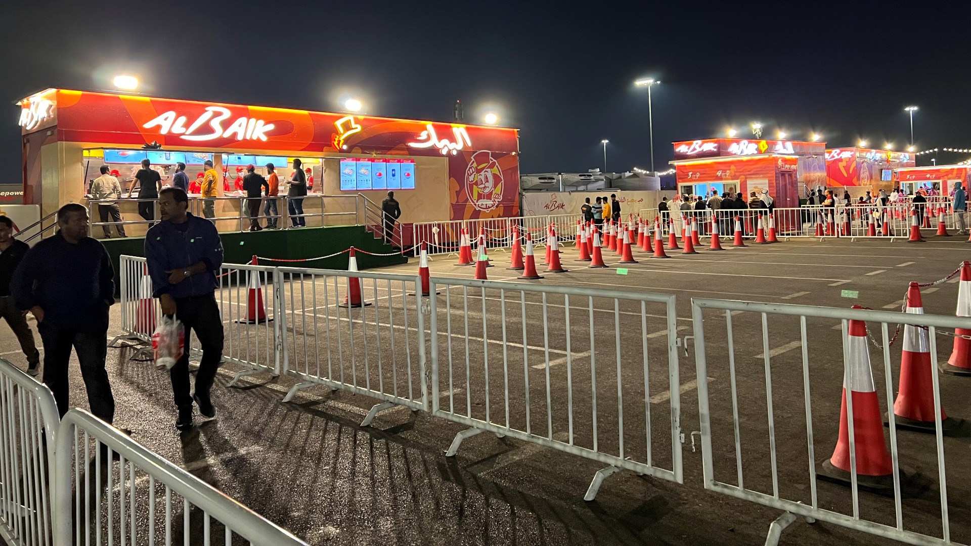 The hugely popular Saudi fast-food chain Al Baik deployed food trucks behind Al Messila metro station in the capital Doha (MEE/Firoz Hassan)