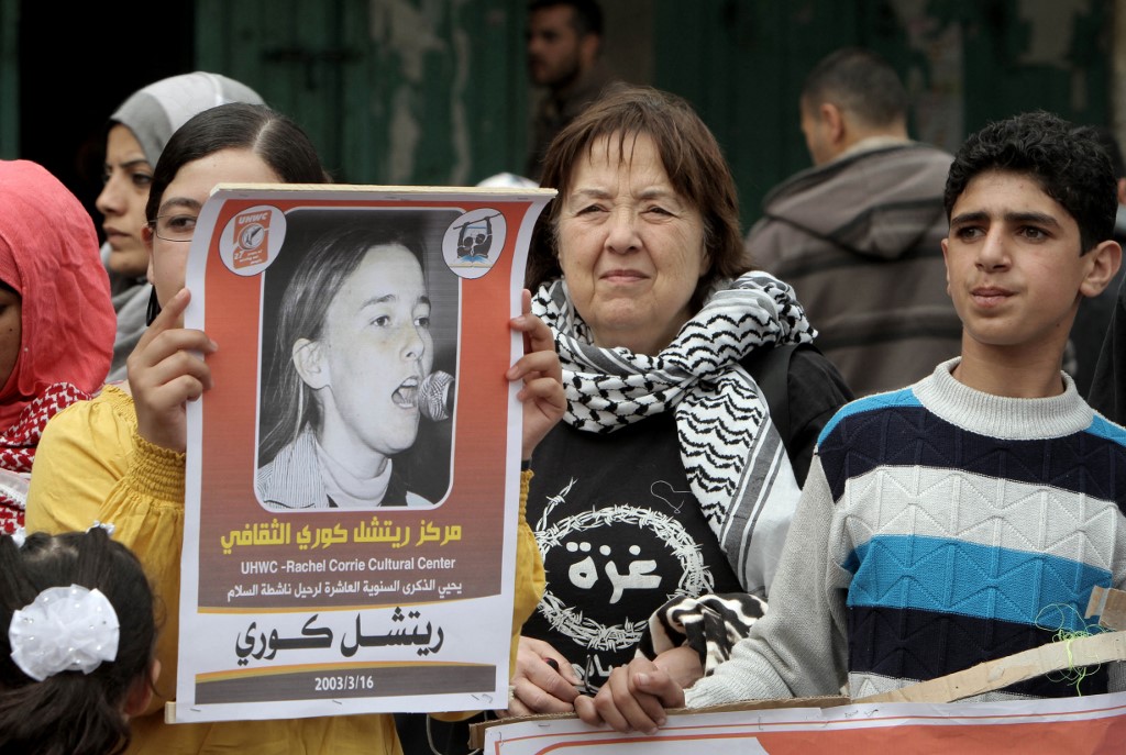 Protesters mark the anniversary of the death of US peace activist Rachel Corrie at a refugee camp in Rafah, Gaza, in March 2013 (AFP)
