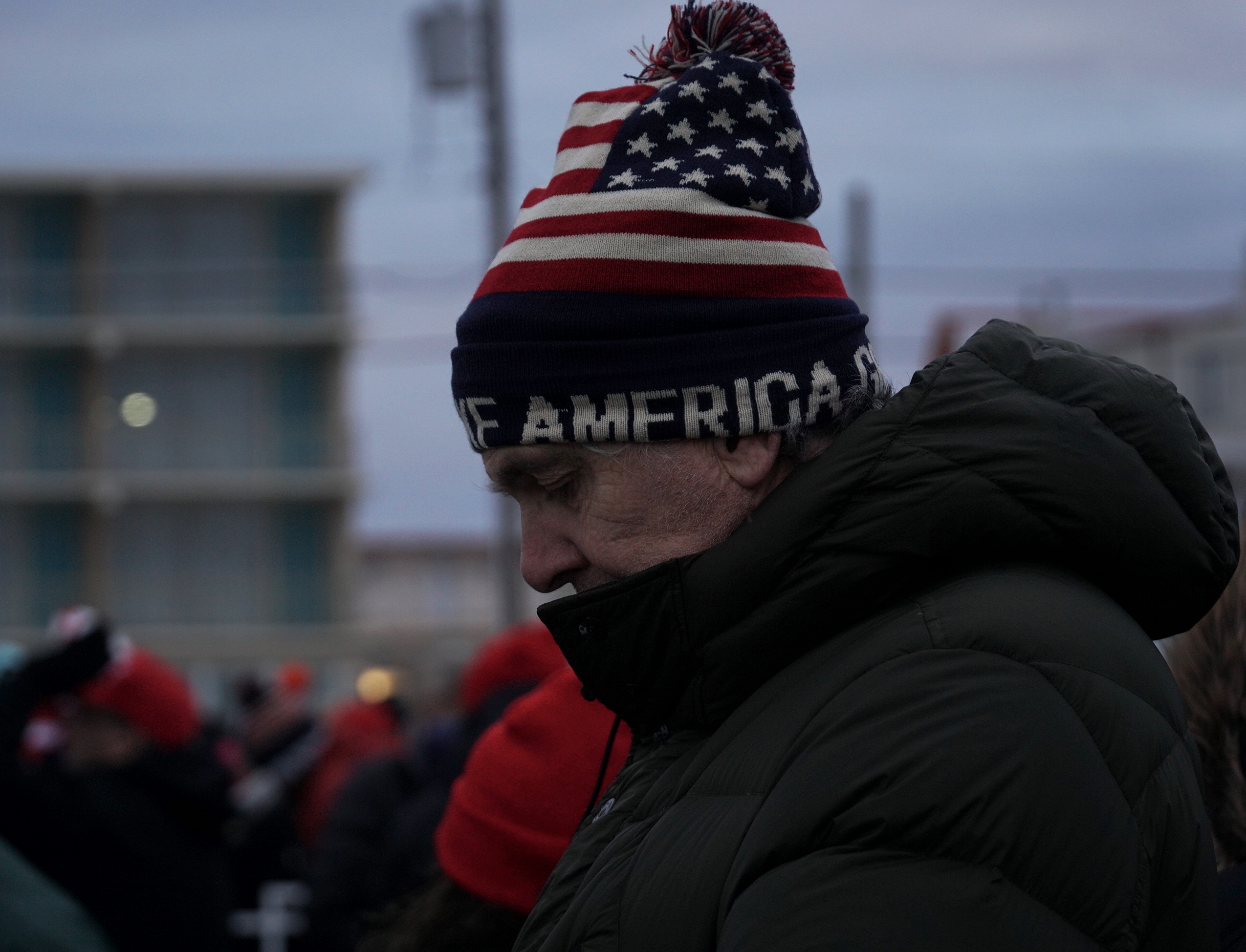 Thousands stood in the frigid conditions to try catch a glimpse of Trump (Azad Essa/MEE)