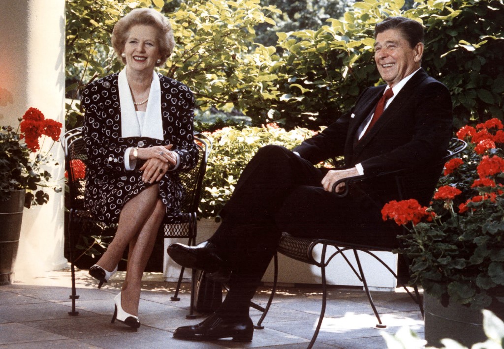 Former US President Ronald Reagan and former British Prime Minister Margaret Thatcher are pictured in Washington in 1987 (AFP)