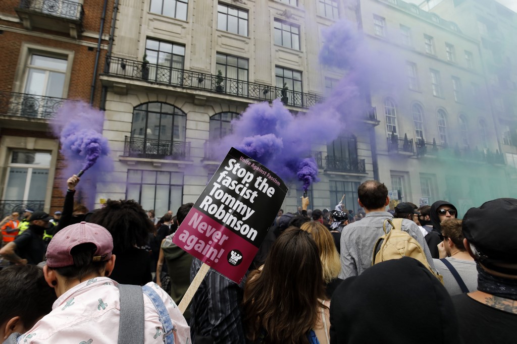 Protesters demonstrate against far-right figure Tommy Robinson in London in August 2019 (AFP)