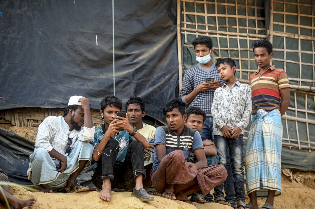Rohingya refugees are pictured at a camp in southern Bangladesh on 11 December (AFP)