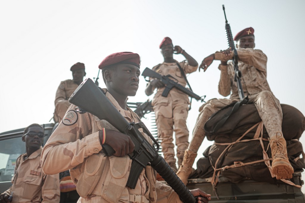 Members of the Rapid Support Forces (RSF) paramilitaries secure the place for a rally for supporters of Sudan's ruling Transitional Military Council (TMC) in the village of Abraq, about 60 kilometers northwest of Khartoum, on June 22, 2019. 