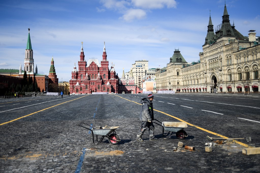 A man works in the deserted Red Square in Moscow on 1 April (AFP)