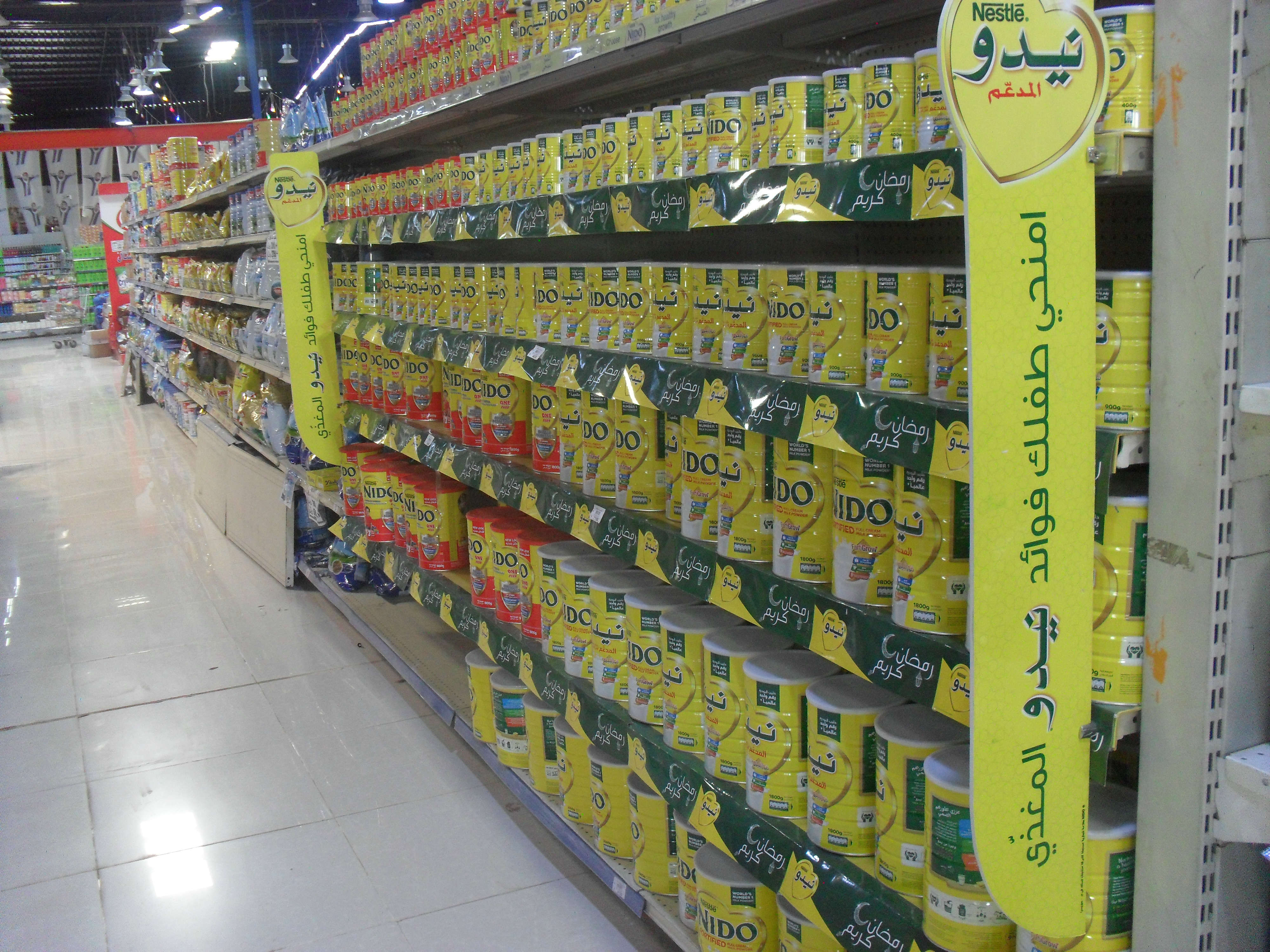 Emirati products line the shelves of a shop in Sanaa (MEE/Naseh Shaker)