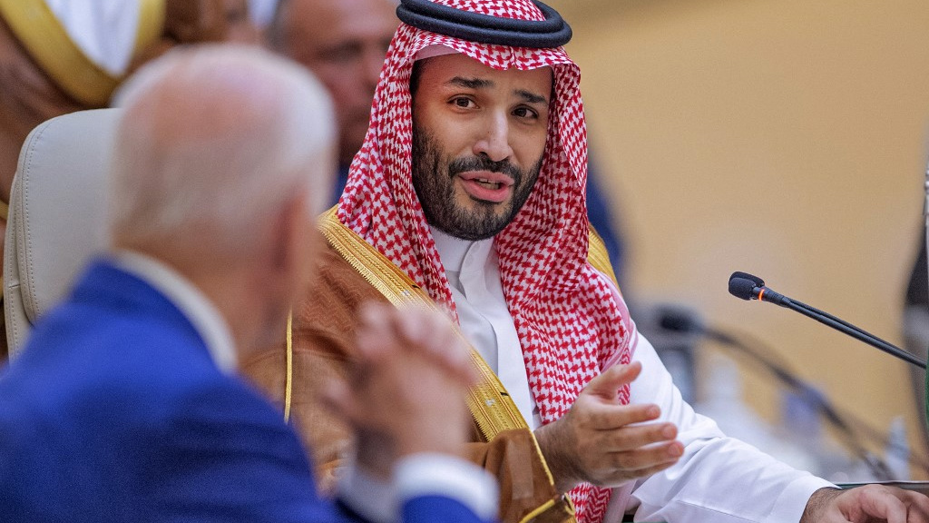 Saudi Crown Prince Mohammed bin Salman speaks with US President Joe Biden during a summit in Jeddah in July 2022 (Bandar al-Jaloud/Saudi Royal Palace/AFP)