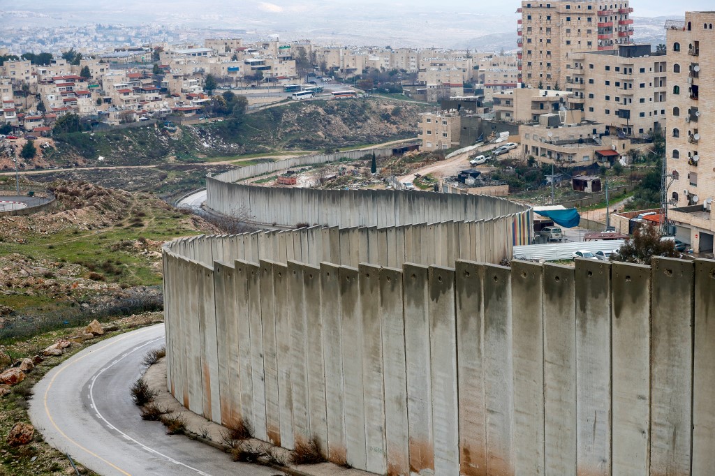 Israel’s controversial separation wall is pictured on 11 February (AFP)