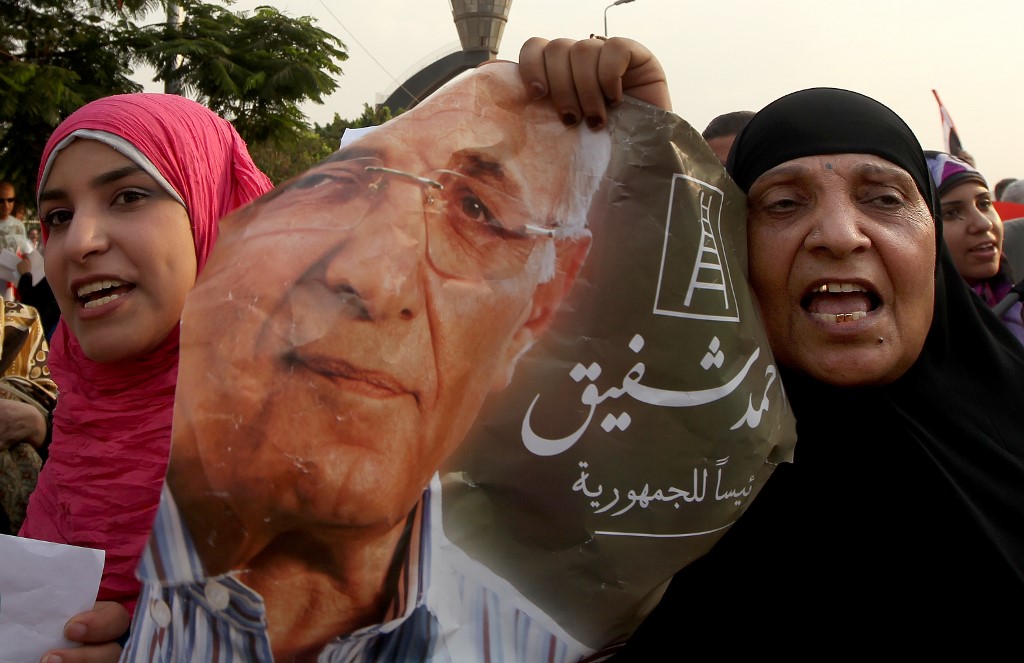 Supporters of then-presidential candidate Ahmed Shafiq demonstrate on the outskirts of Cairo in 2012 (AFP)
