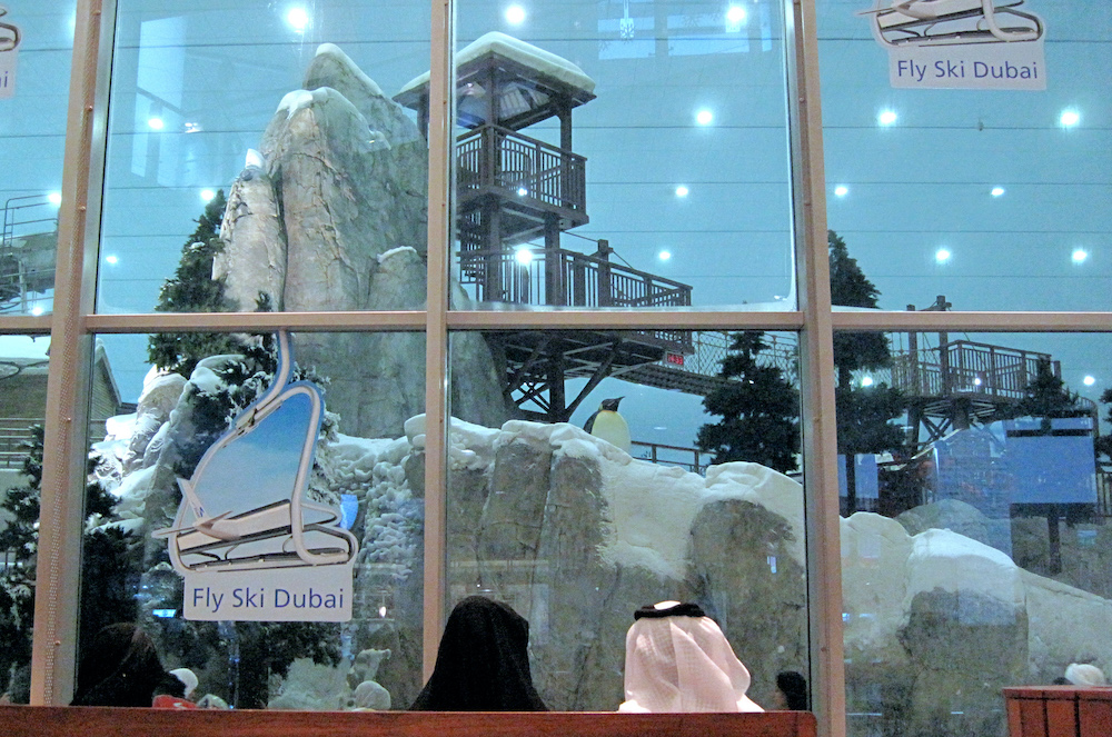 A couple sit outside of Ski Dubai in the Mall of the Emirates in 2009 (AFP)