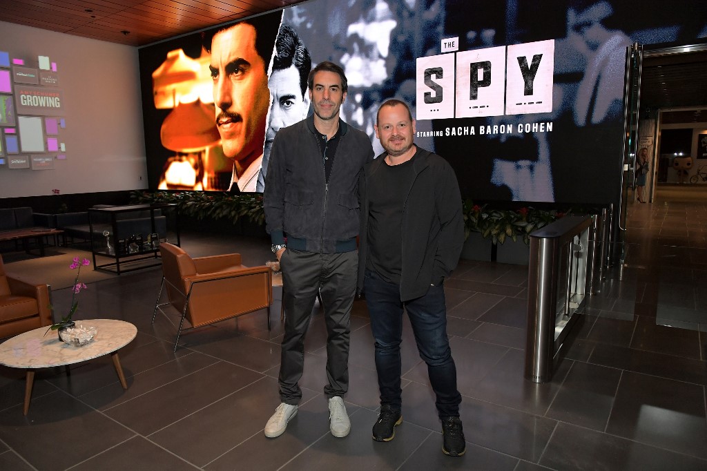 Sacha Baron Cohen and Gideon Raff attend a screening for The Spy in LA on 5 September (AFP)
