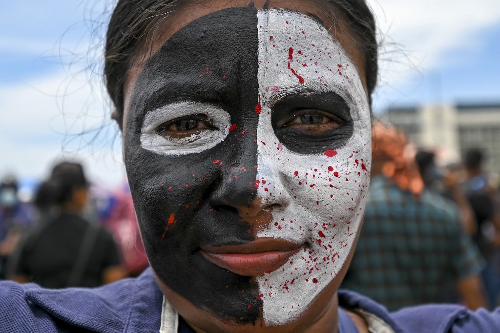 A protester participates in an anti-government demonstration outside the President's office in Colombo on April 25, 2022, demanding President Gotabaya Rajapaksa’s resignation over the country's crippling economic crisis.