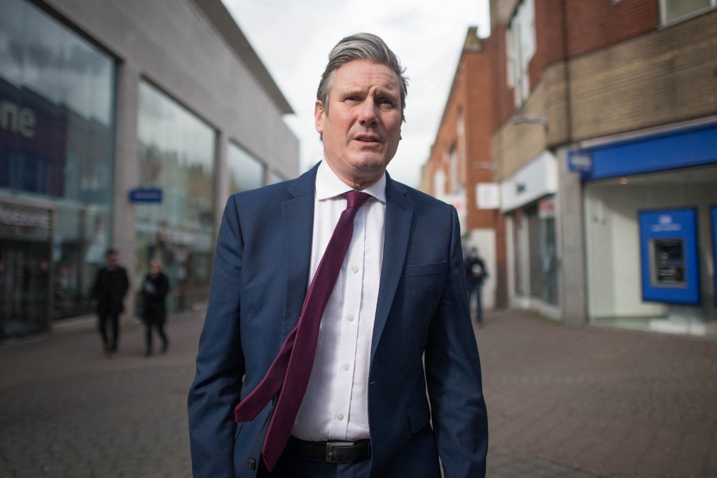 Britain's main opposition Labour Party leader Keir Starmer walks around Crawley town centre in West Sussex on March 11, 2021, 