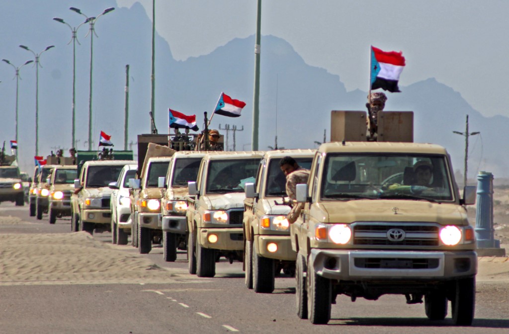 A convoy of forces dominated by members of Yemen’s Southern Transitional Council heads from Aden to Abyan province on 26 November (AFP)