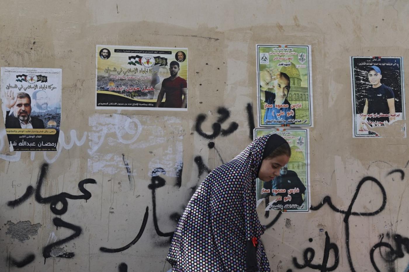 Posters of Palestinian martyrs and prisoners are plastered all over in Jenin refugee camp. (Afp)