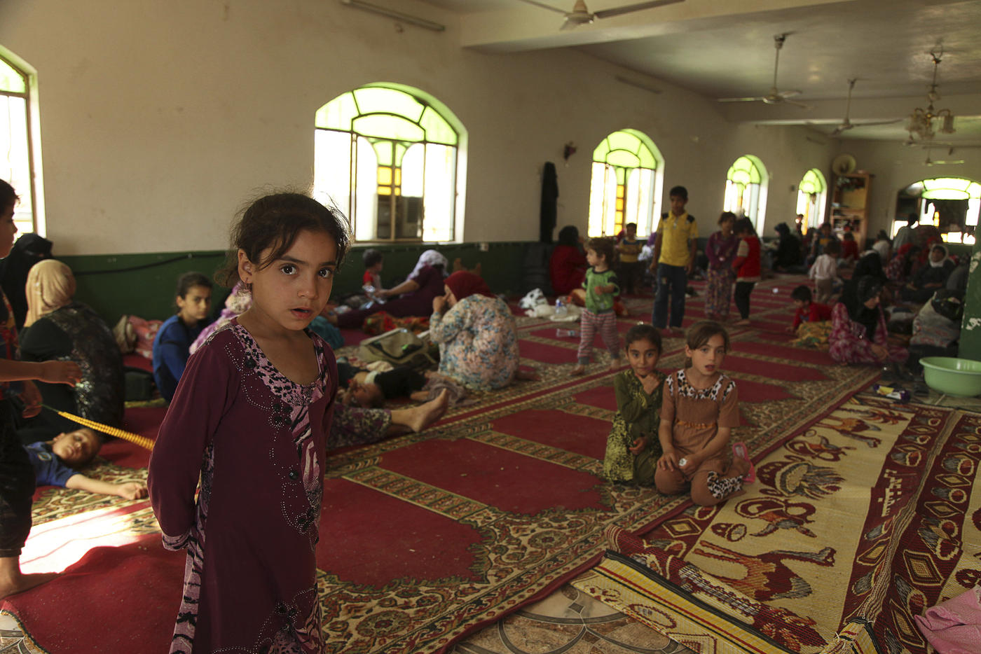 Iraqi Shia Turkmen families who fled Tal Afar rest in Shangal, a town in Nineveh province, in June 2014 (Reuters)