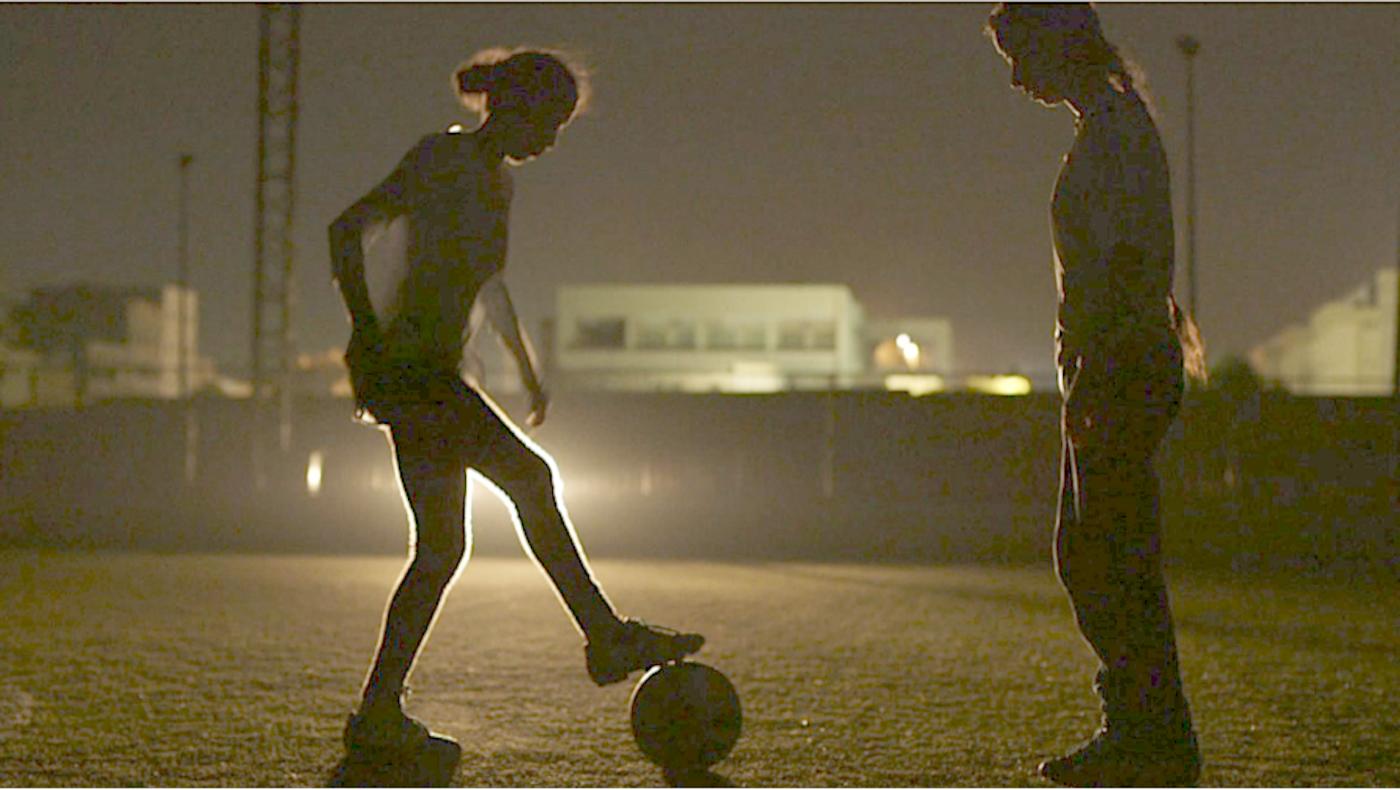 football practice in dark power cuts Tripoli