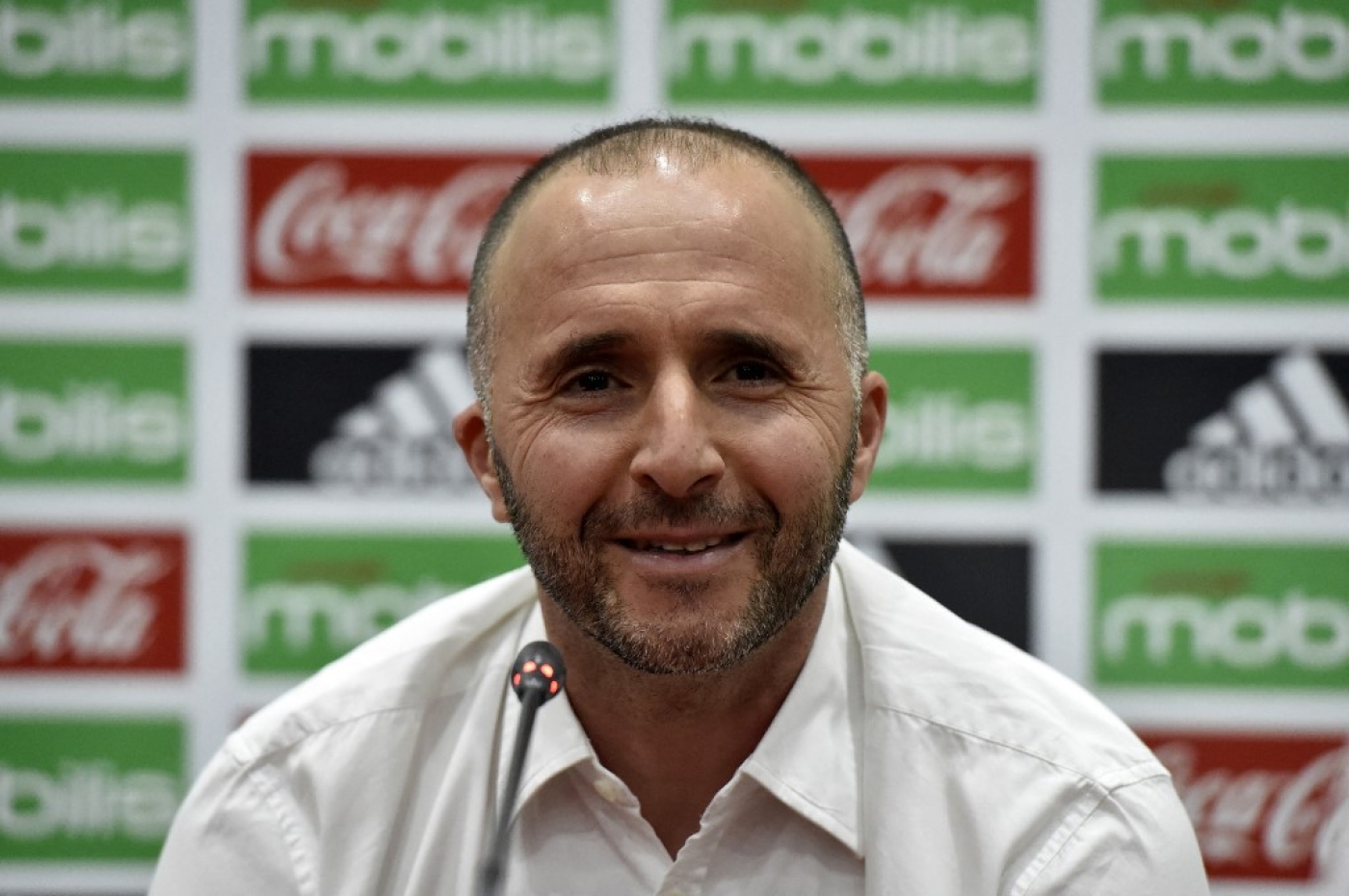 L’entraîneur des Verts Djamel Belmadi lors d’une conférence de presse à Alger, le 18 août 2018 (AFP/Ryad Kramdi)