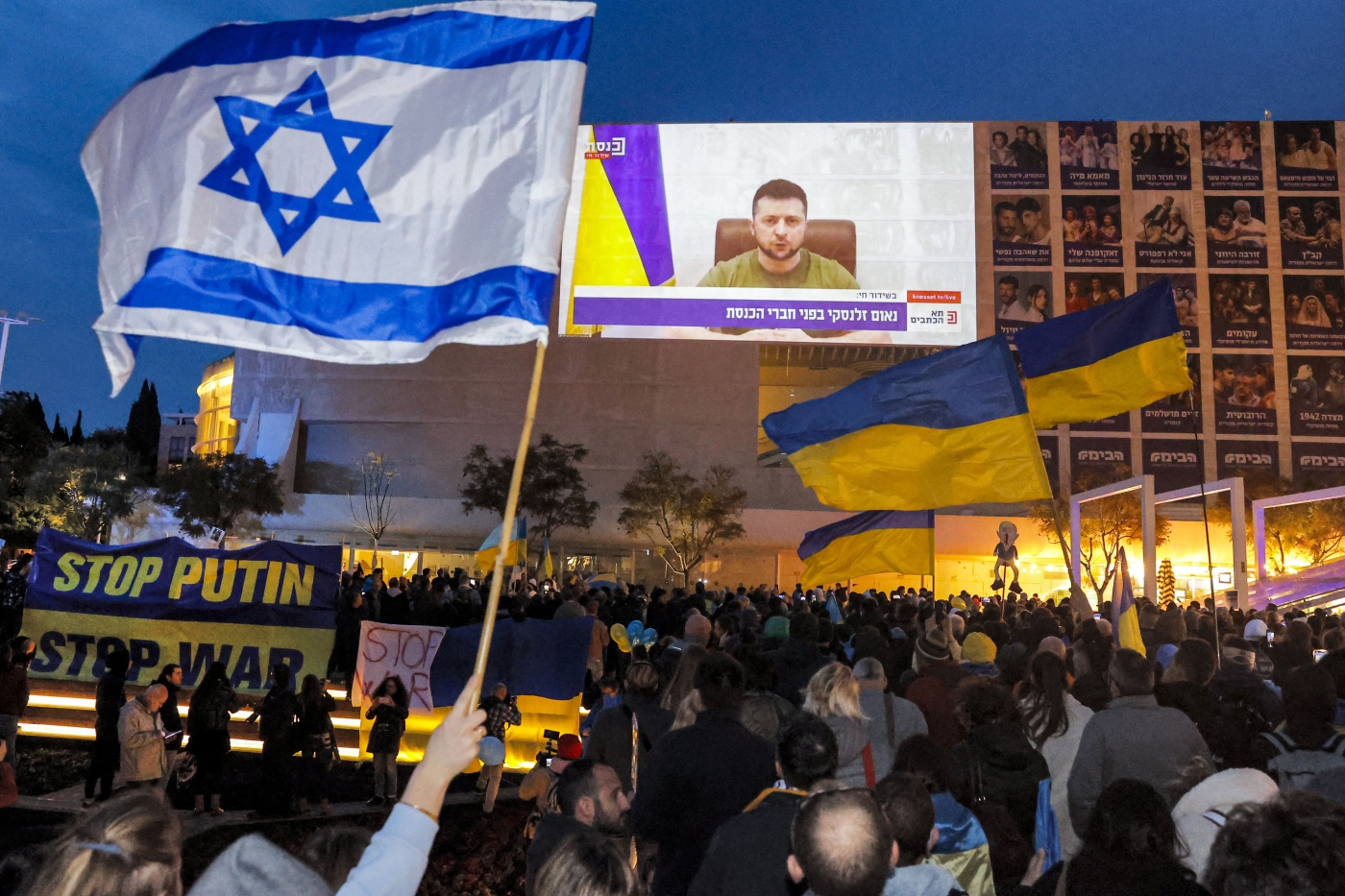 Demonstrators gather at Habima Square in the centre of Israel's Mediterranean coastal city of Tel Aviv on March 20, 2022 to attend a televised video address by Ukraine's President Volodymyr Zelensky to the Israeli Knesset (AFP)